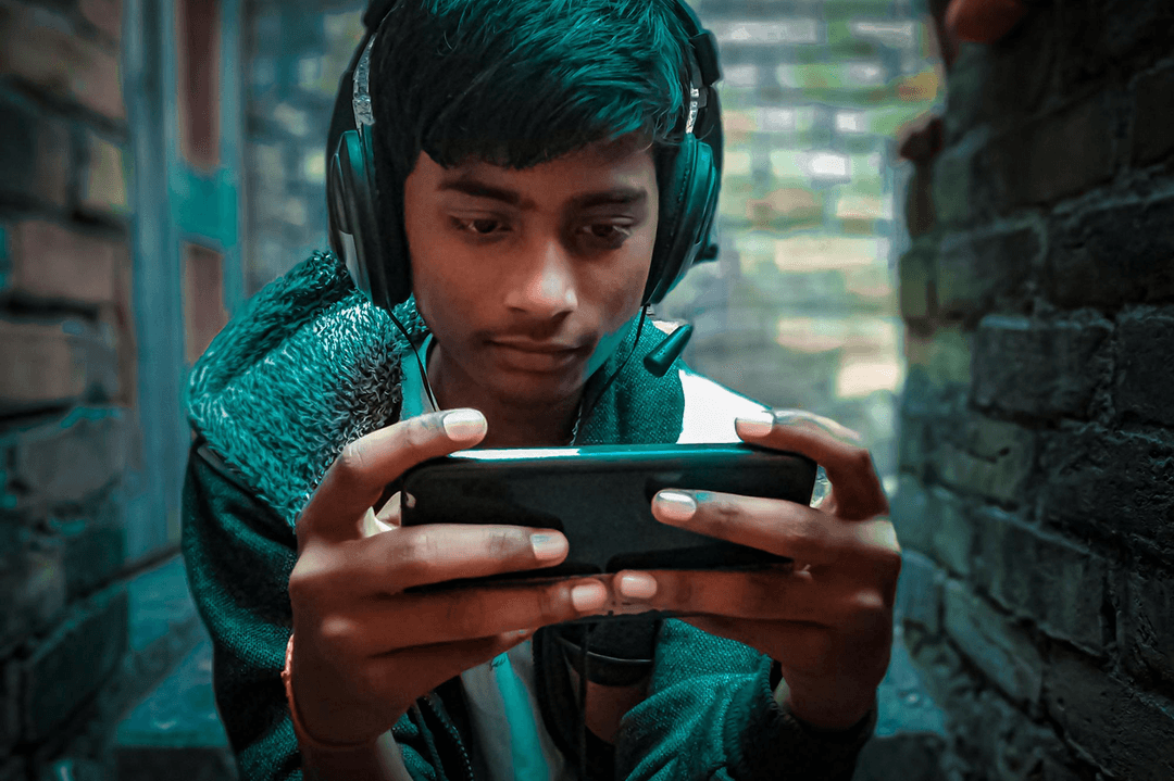 Child playing on mobile instead of studying